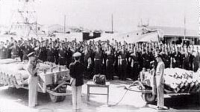 Taking the oath before seeing the secret Norden bombsight on the table. (U.S. Air Force photo)
