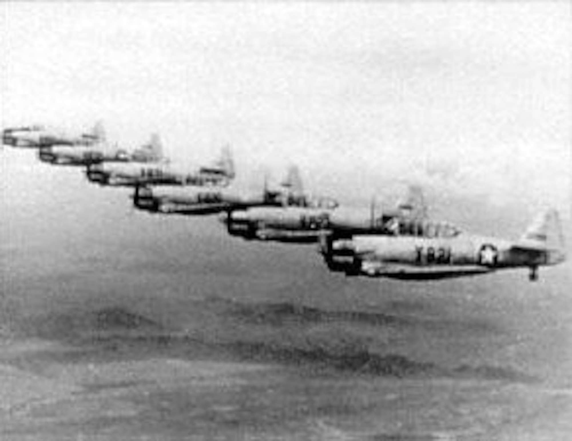 North American AT-6s in line-abreast formation. (U.S. Air Force photo)