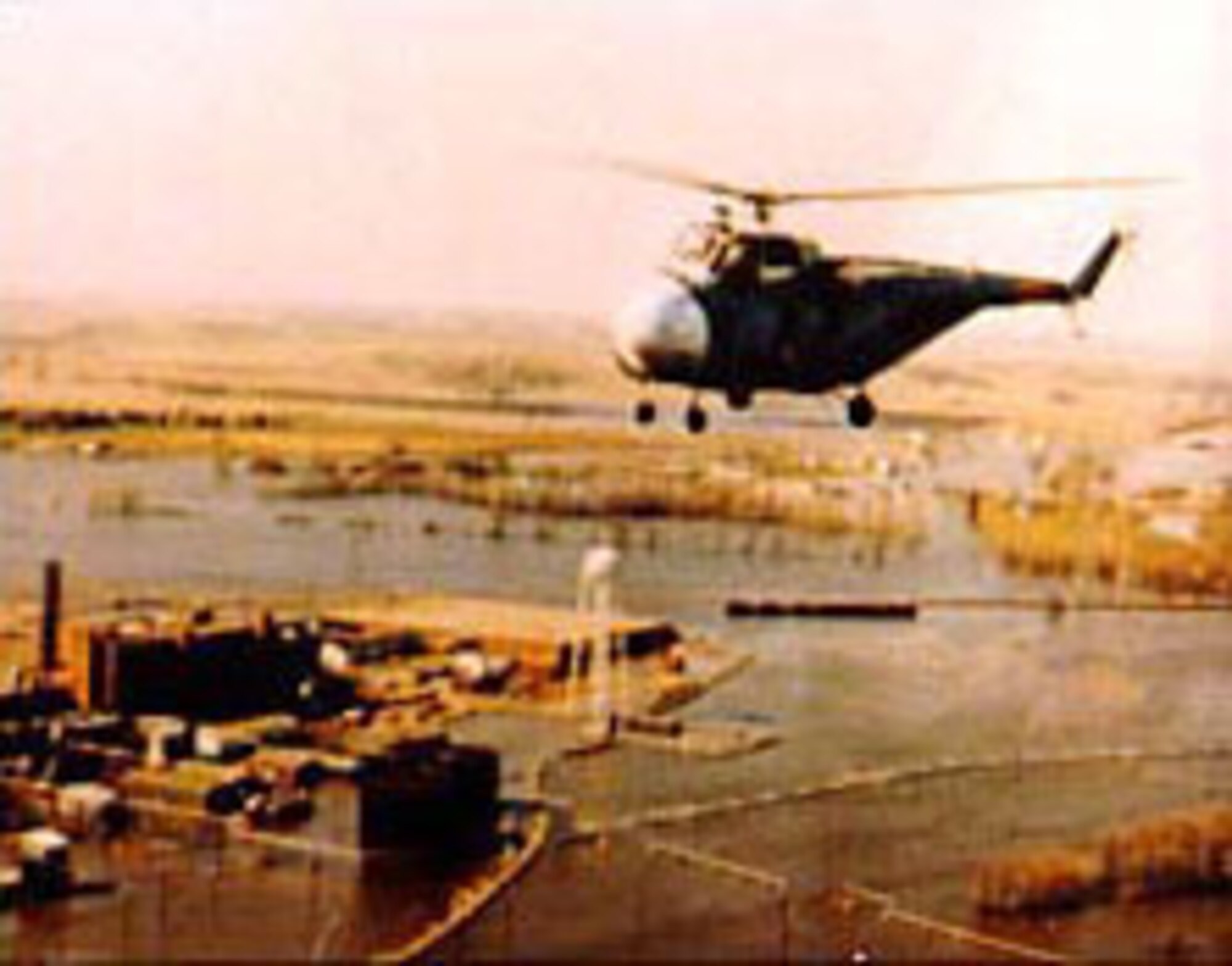 An H-19 crew searches for victims on the flooded Red River at Grand Forks, N.D., in 1965. (U.S. Air Force photo)