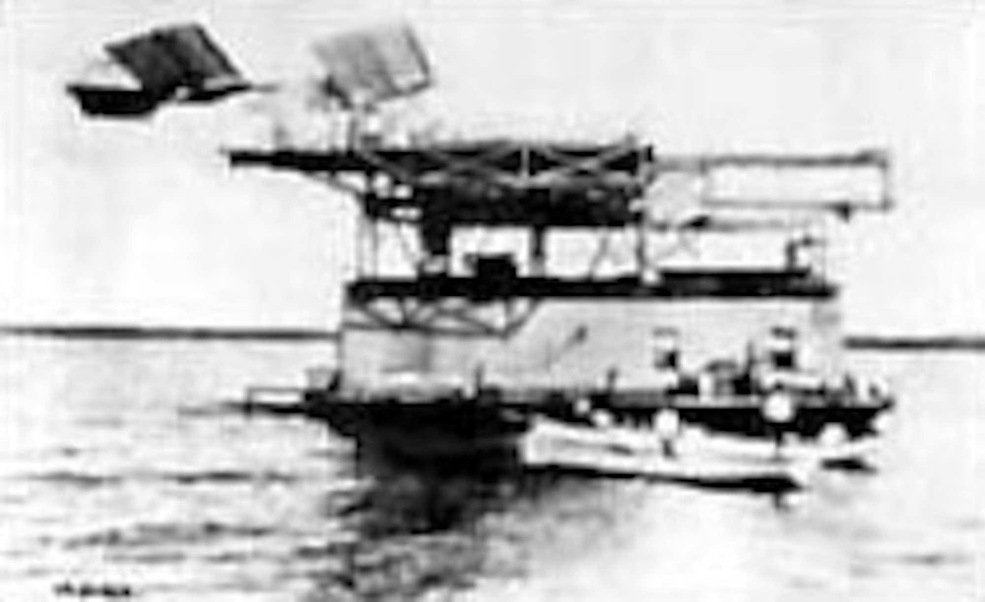 Charles M. Manly attempts to fly from the deck of a houseboat on the Potomac River. The flight was unsuccessful. (U.S. Air Force photo)