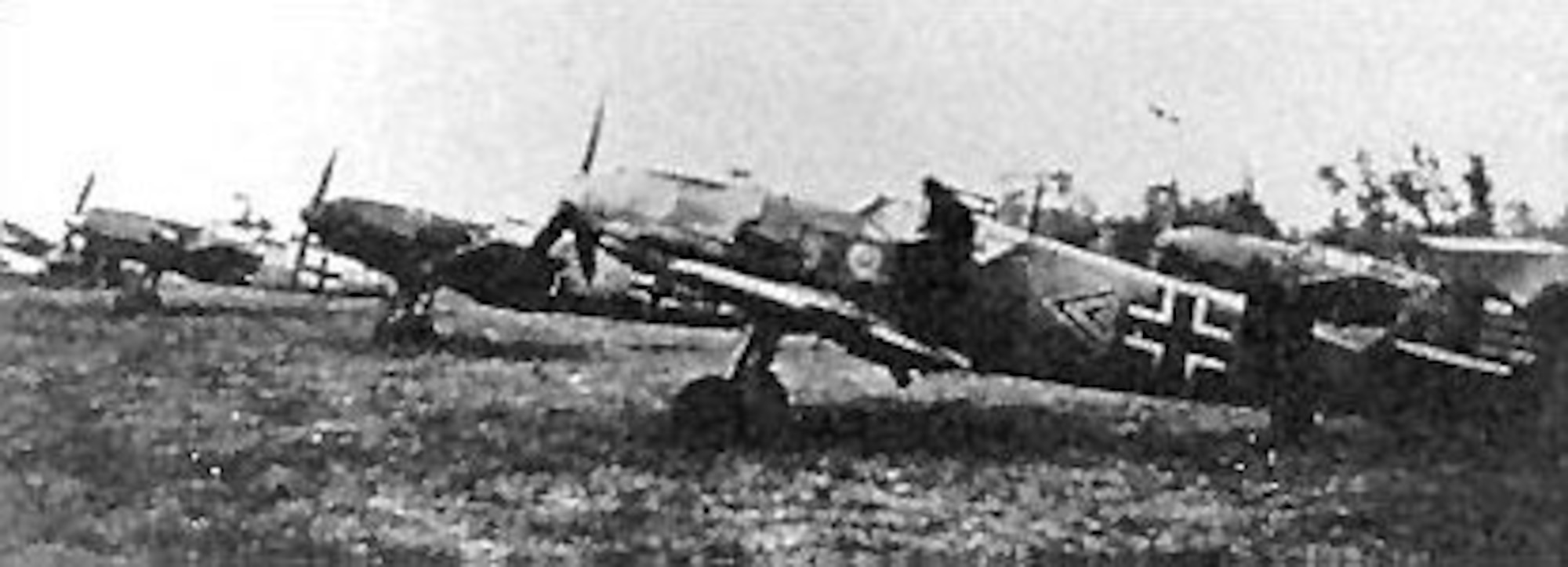 Me 109s of JG/2 (the Richthofen Squadron) at a Luftwaffe airfield in Western Europe in the summer of 1940. The plane in the foreground was assigned to Oberleutnant Helmut Wick, a Luftwaffe ace with 56 victories at the time he was shot down on Nov. 28, 1940. Wick had 32 victory bars on the rudder of his plane at the time this photo was taken. (U.S. Air Force photo)