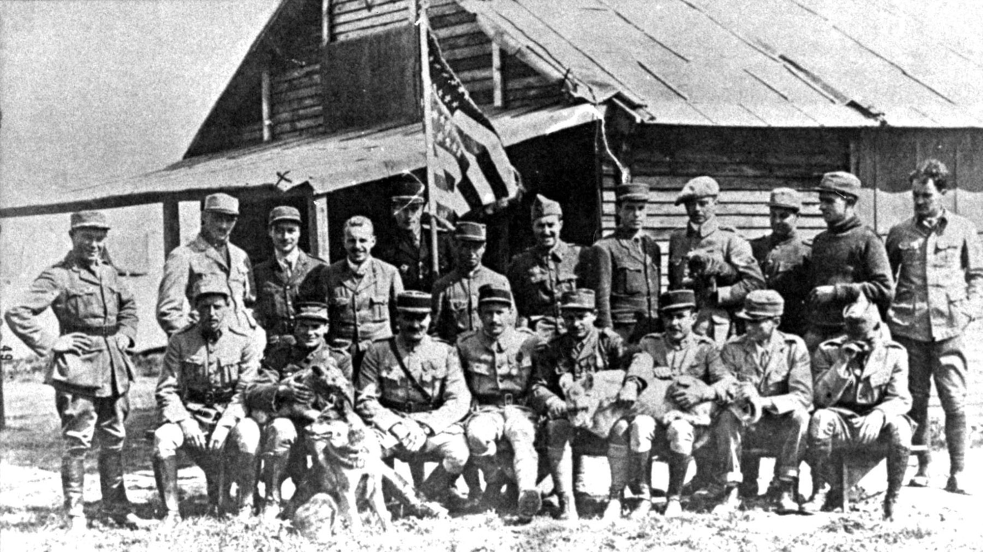 The Escadrille Lafayette in July 1917. Standing, left to right are Soubiron, Doolittle, Campbell, Persons, Bridgman, Dugan, MacMonagle, Lowell, Willis, Jones, Peterson and de Maison-Rouge (French Deputy Commander). Seated, left to right are Hill, Masson with "Soda," Thaw, Thenault (the French Commander), Lufbery with "Whiskey," Johnson, Bigelow and Rockwell. (U.S. Air Force photo)