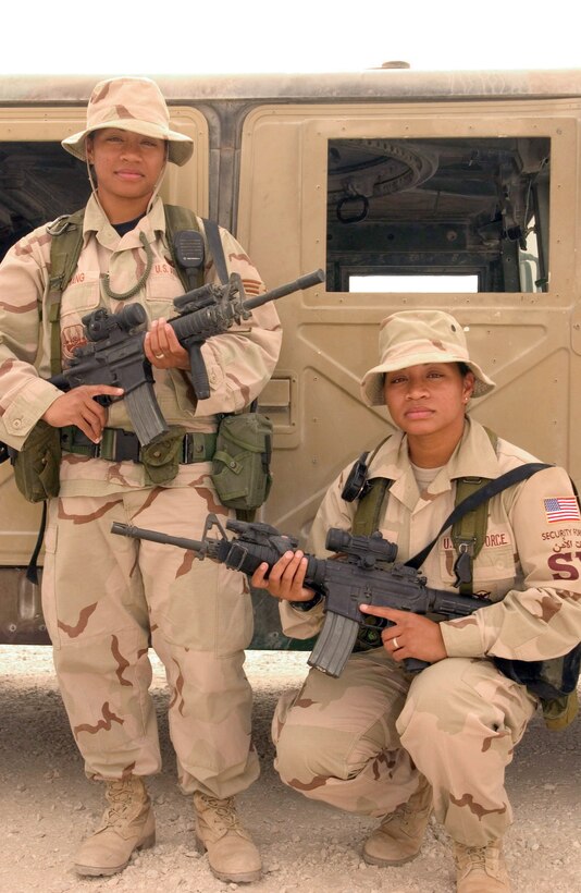 SOUTHWEST ASIA (AFPN) -- Senior Airmen Levina Sumang and Levana Raum volunteered to deploy here together to provide security for the base. The twins are with the 379th Expeditionary Security Forces Squadron and deployed from the Hawaii Air National Guard's 154th Wing. (U.S. Air Force photo by Senior Airman Cassandra Locke)