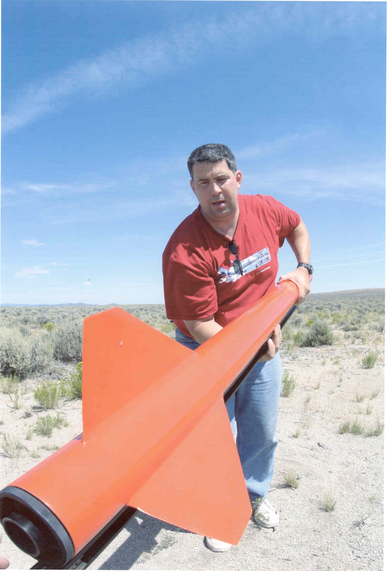 McChord Air Force Base, Wash. -- Lt. Col. Jim Wilerson, 313th Airlift Squadron, sets up his rocket in the Black Rock Desert, Nev. The rocket reached a speed of about Mach 1.5 in approximately four seconds. (Photo Courtesy of Tsolo T. Tsolo)