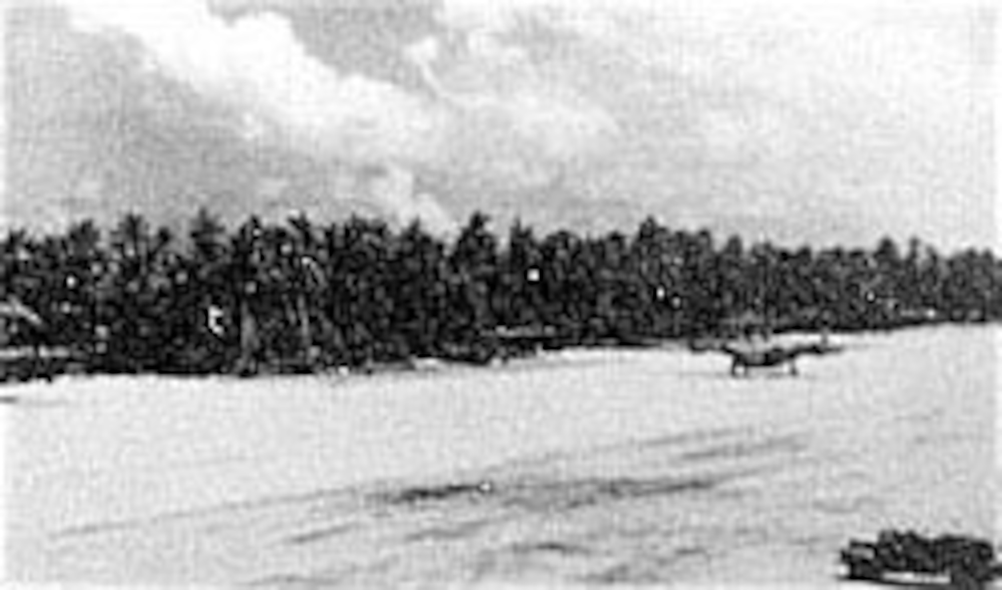 A B-24 lands at Nanumea in the Ellice Islands in December 1943. The field was a refueling stop for 7th Air Force bombers flying long-range missions against the Gilberts. Additional B-24s are dispersed in revetments along the runway. (U.S. Air Force photo)