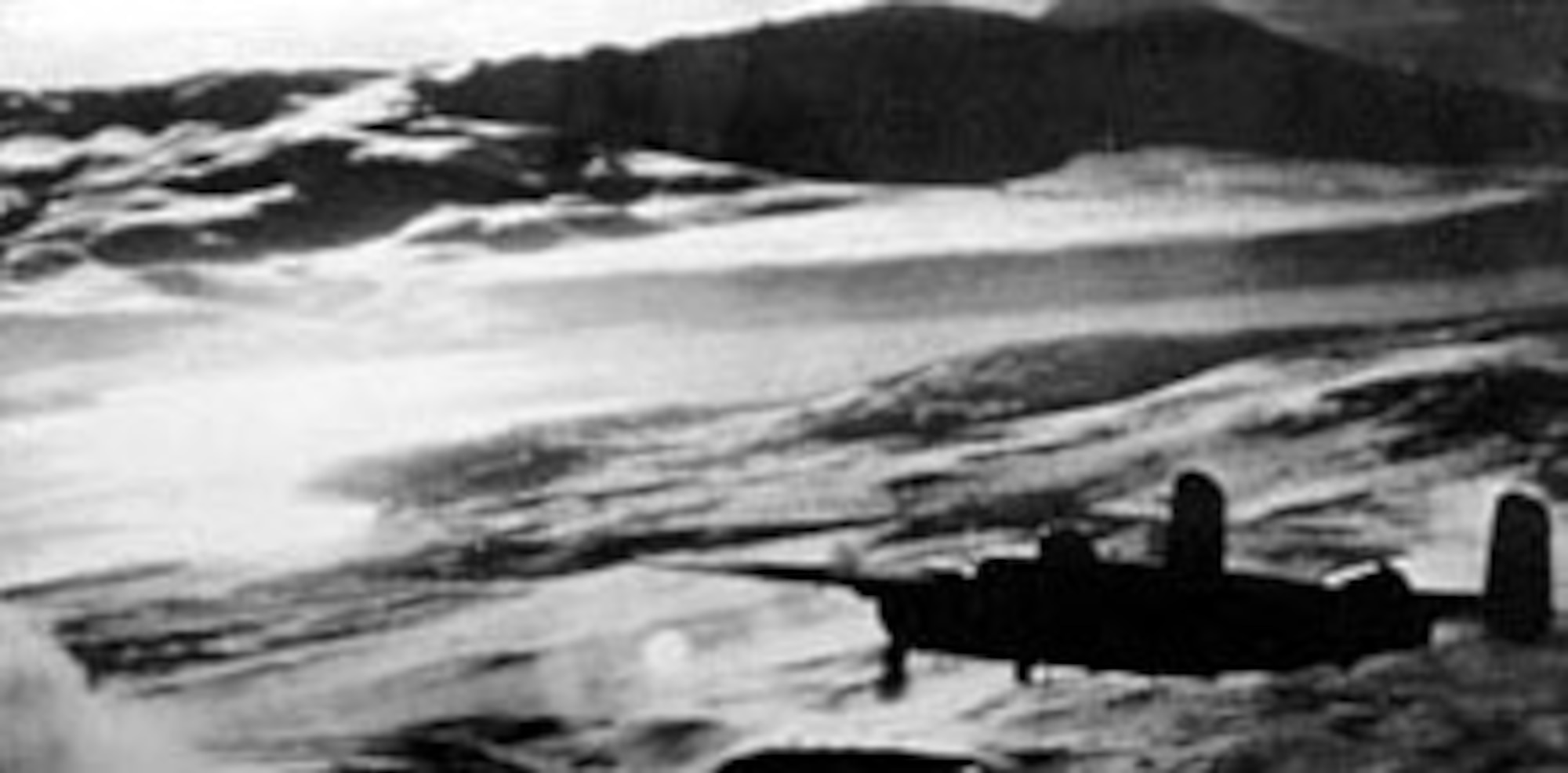 An 11th Air Force B-25 based in the Aleutian Islands leads an attack on an enemy convoy near the Kurile Islands. This air strike left six Japanese vessels either sunk or damaged. (U.S. Air Force photo)
