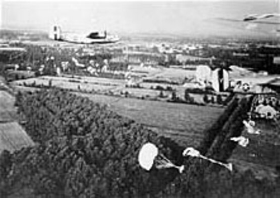 B-24s drop supplies to paratroopers fighting in Holland. (U.S. Air Force photo)