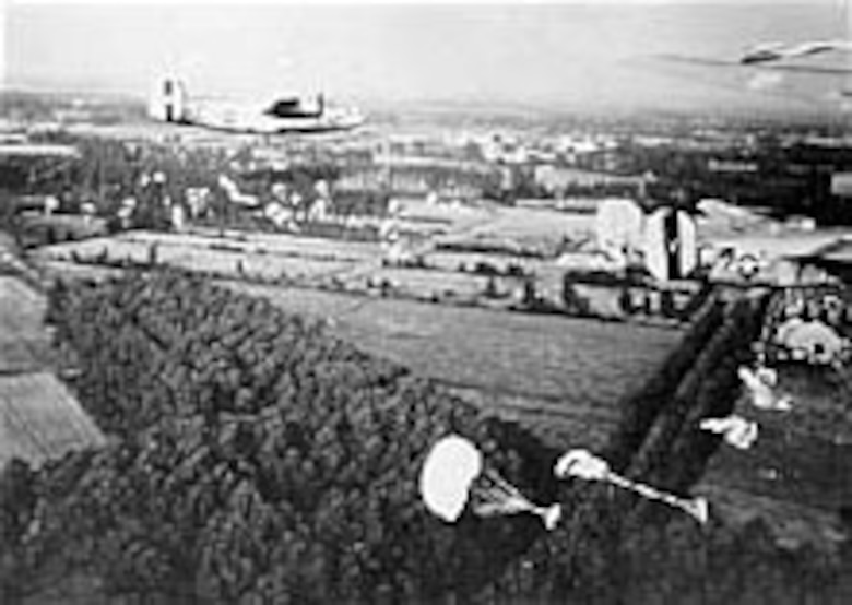 B-24s drop supplies to paratroopers fighting in Holland. (U.S. Air Force photo)