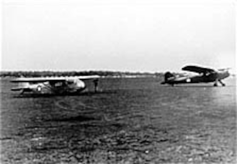 A Piper TG-8 (at left) is ready for towing by an L-1A. Some liaison aircraft by Piper (L-4/TG-8), Aeronca (L-3/TG-5) and Taylorcraft (L-2/TG-6) were converted into unpowered training gliders by the extension of the forward fuselage and other modifications. (U.S. Air Force photo)