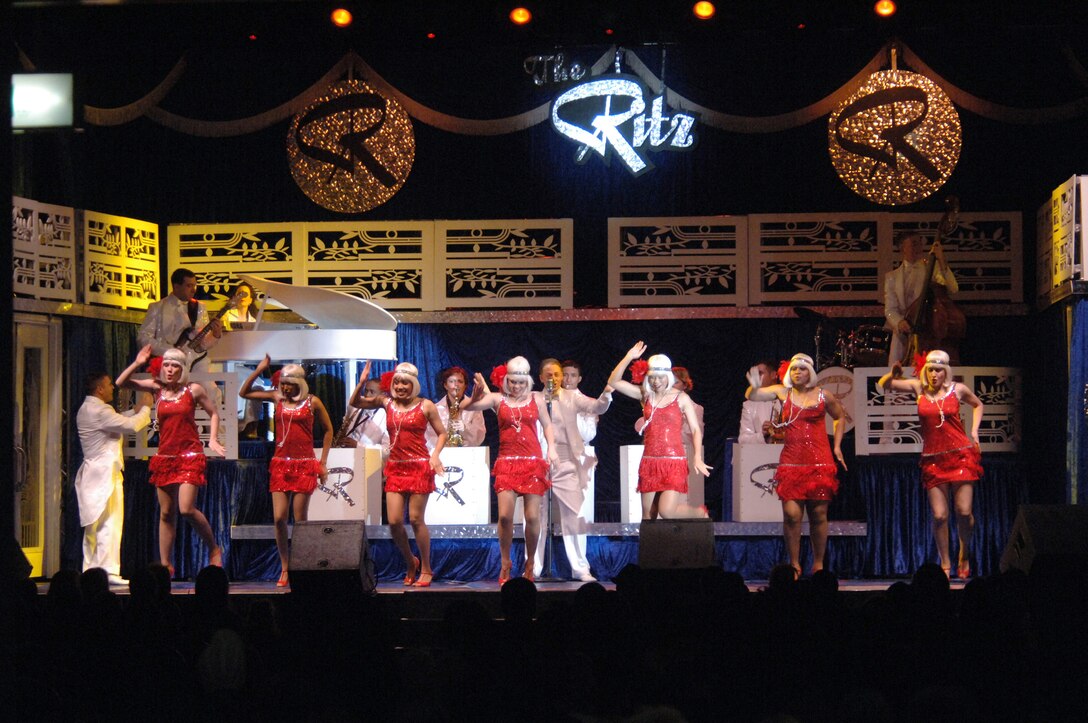 YOKOTA AIR BASE, Japan (AFPN) -- Members of the Air Force Tops in Blue entertainment troupe perform for several hundred people here. The group -- called the Air Force's "expeditionary entertainers -- performed a 90-minute music, dance and comedy show here today. The group travels to provide entertainment where ever U.S. troops are -- especially those in remote locations around the world. (U.S. Air Force photo by Master Sgt. Val Gempis).  