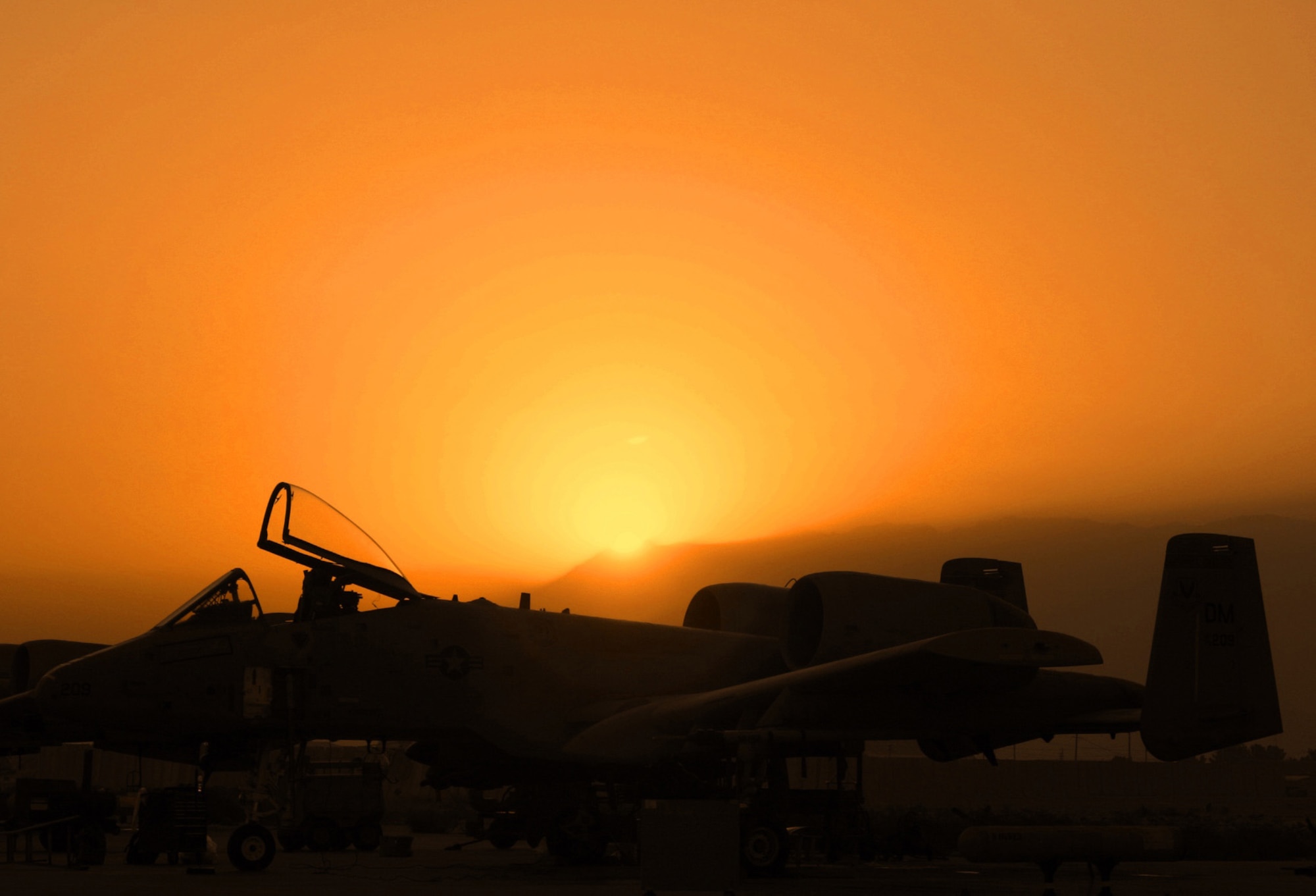 BAGRAM AIR BASE, Afghanistan (AFPN) -- The setting sun silhouettes an A-10 Thunderbolt II after a combat mission. Since Sept. 15, A-10s here have flown more than 1,700 combat sorties, totaling more than 6,000 combat hours in support of Operation Enduring Freedom. The A-10 was the first Air Force aircraft specially designed for close-air support of ground forces. (U.S. Air Force photo by Chief Master Sgt. David L. Stuppy) 
