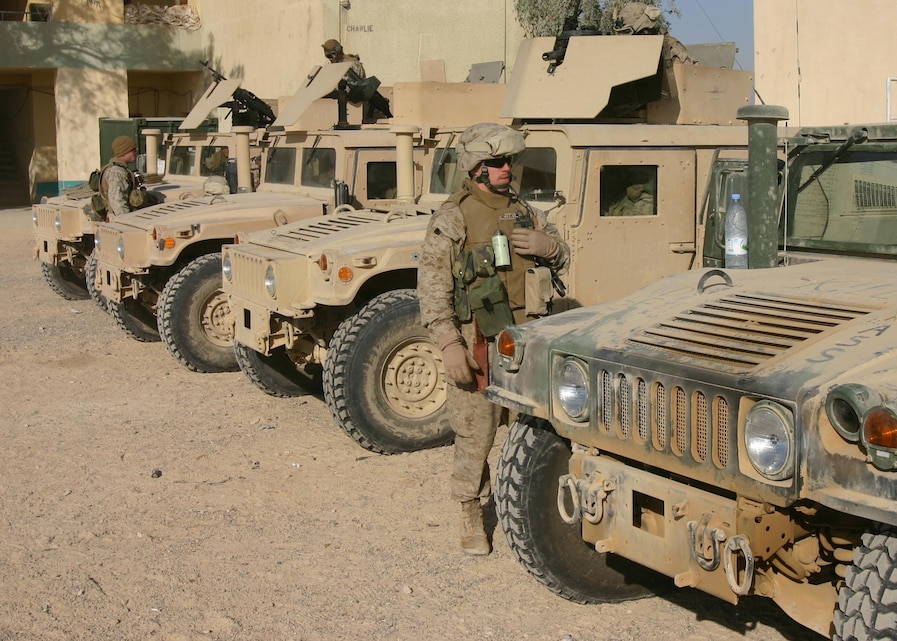 Sergeant Ryan McQuillen, of Frederick, Md., an infantryman with Alpha Co., Battalion Landing Team 1st Bn., 2nd Marines make a final 'comm' check before heading out on a security patrol near Hit, Iraq, Dec. 29, 2005.  BLT 1/2 is the ground combat element of the 22nd Marine Expeditionary Unit (Special Operations Capable), which is conducting combat operations in Iraq's Al Anbar province in support of Operation Iraqi Freedom.