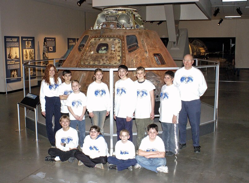 DAYTON, Ohio -- Members of the "Blue Moon Inventors" pose for a photo at the National Museum of the United States Air Force. Front row (left to right):
Alex Kosan (Otway, Ohio); Cherylyn Geers (Hamilton, Ohio); Conrad Bambeck (West Alexandria, Ohio); Tyler Hudgins (Louisville, Ky.). Back row (left to right): Cindy Henry (teacher); Brandon Edge (Fairborn, Ohio); Joseph Broyles (Dayton, Ohio); Erin Buckey (Fairborn, Ohio); Brad Theilman (Milford, Ohio); Evan Todd (Columbus, Ohio); Chris McAuley (Fairborn, Ohio) and Bob Robke (mentor). (U.S. Air Force photo)