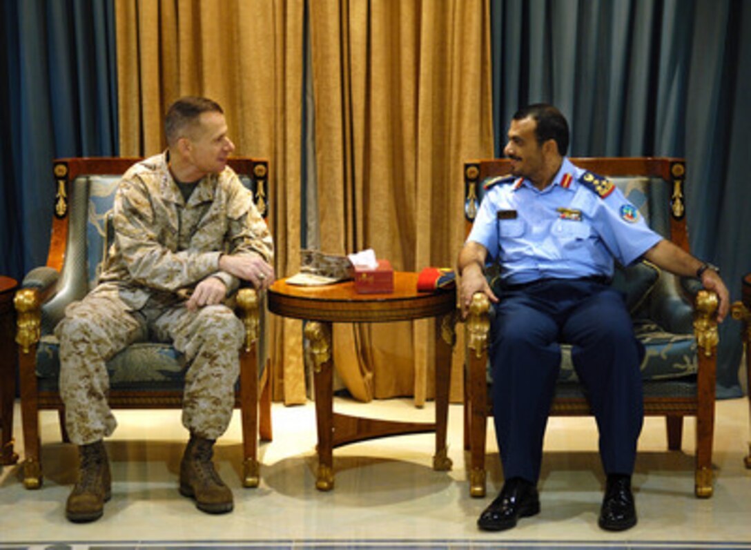 Chairman of the Joint Chiefs of Staff Gen. Peter Pace, U.S. Marine Corps, and United Arab of Emirates Brigadier Gen. Rashid Al Saadi discuss military to military relations during a visit to the United Arab of Emirates on Dec. 29, 2005. Pace is in the Persian Gulf region to visit troops deployed during the holiday season. A USO-sponsored troupe including 2004 American Idol finalist Diana DeGarmo, country music star Michael Peterson and comedian and actor Reggie McFadden is traveling with Pace. 