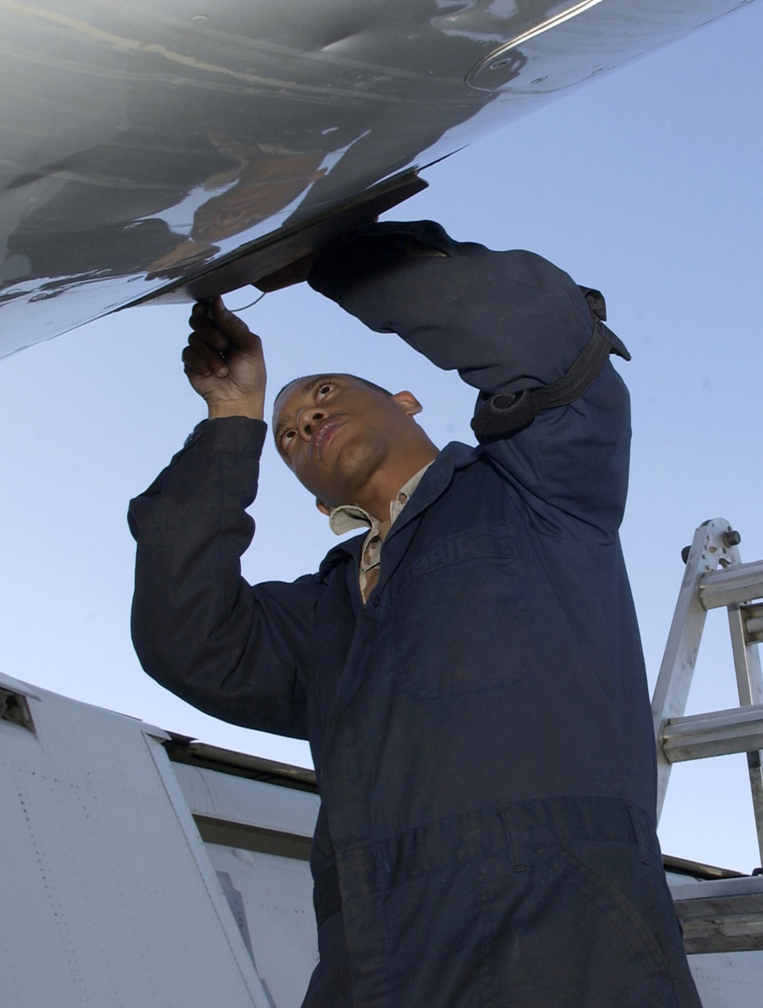 SOUTHWEST ASIA -- Staff Sgt. Tony Abair works on an E-8C Joint STARS aircraft.  He is a jet propulsion mechanic with the 379th Air Expeditionary Wing at a forward-deployed location here from Robins Air Force Base, Ga.  (U.S. Air Force photo by Senior Master Sgt. John P. Snow)