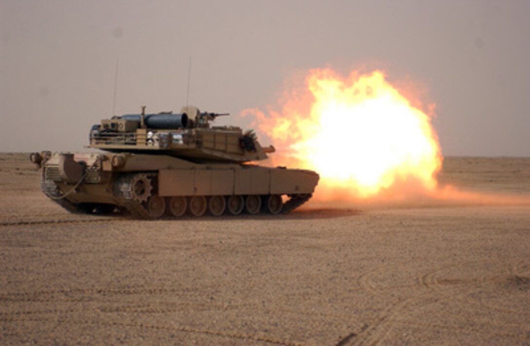 U.S. Marines fire the main gun of their M1A1 Abrams tank in the western desert of the Najaf Province of Iraq during a training exercise on Jan. 24, 2005. The Marines, assigned to Tank Platoon, Battalion Landing Team 1st Battalion, 4th Marines, 11th Marine Expeditionary Unit Special Operations Capable train monthly to maintain proficiency. 