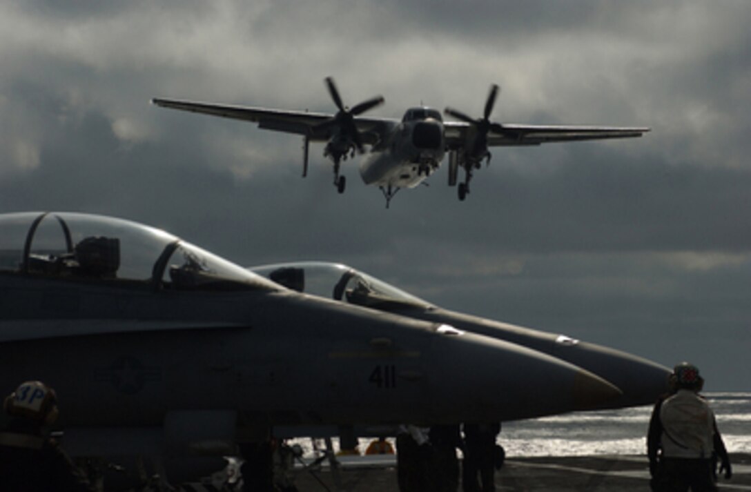 A C-2A Greyhound makes its final approach for landing on the flight deck of the aircraft carrier USS Theodore Roosevelt (CVN 71) during flight operations on Jan. 30, 2005. The Roosevelt is underway to conduct Fleet Replacement Squadron Carrier Qualifications. 