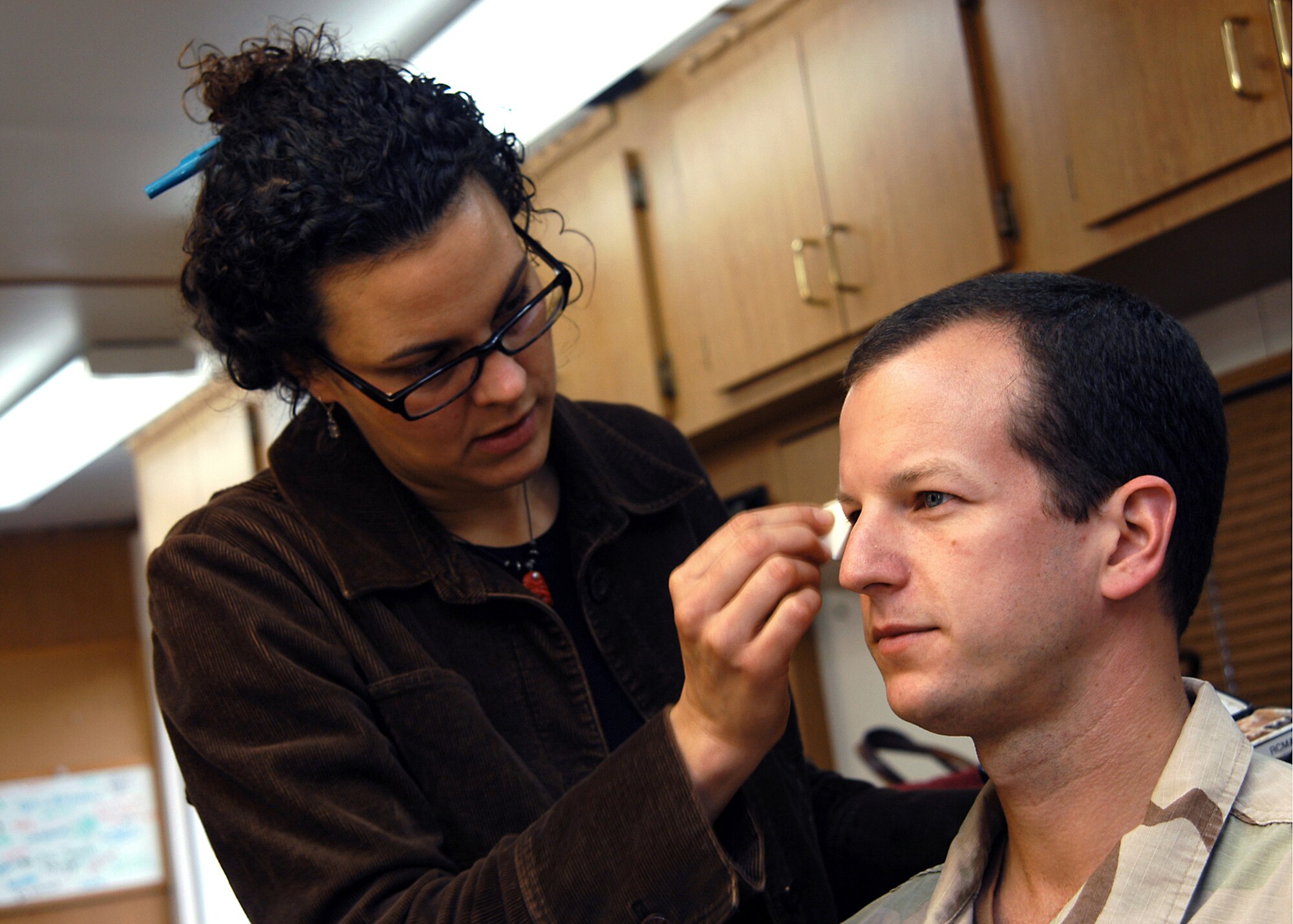 LOS ANGELES -- First Lt. Jeff McGowan has make up applied before shooting his scene for a commercial scheduled to air during the Super Bowl.  Lieutenant McGowan is an engineer at the Space and Missile Systems Center at nearby Los Angeles Air Force Base.  (U.S. Air Force photo by Jason M. Webb)