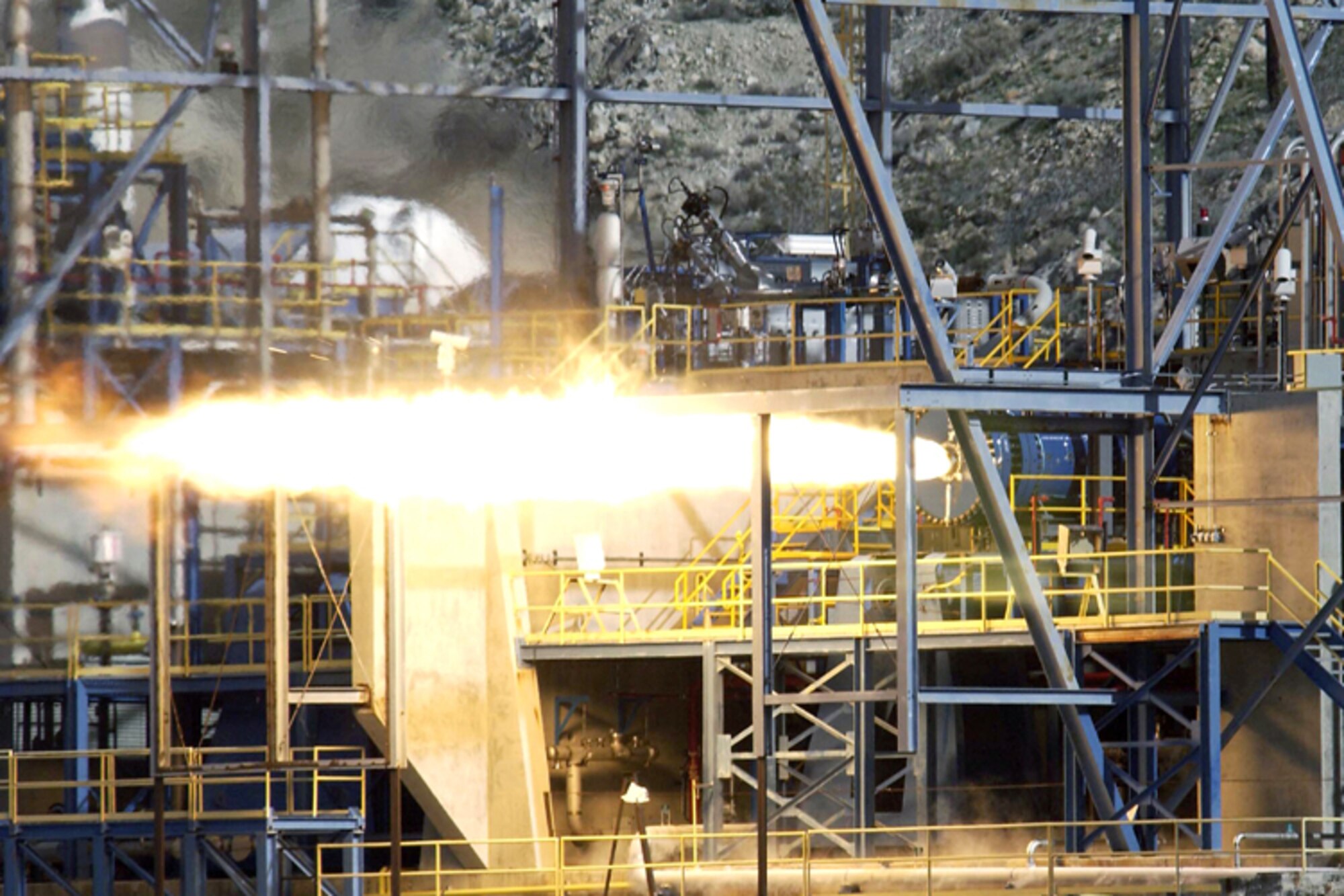 EDWARDS AIR FORCE BASE, Calif. -- A large hybrid rocket motor successfully fires on its test stand here recently.  The test took place on an Air Force Research Laboratory test stand on a ridge overlooking the dry lake bed and surrounding Mojave Desert here.  (Courtesy photo)