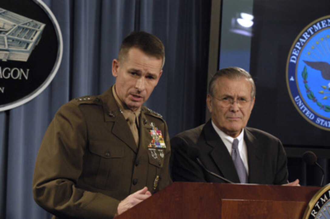 Vice Chairman Joint Chiefs of Staff Gen. Peter Pace, U.S. Marine Corps, (left) responds to a reporter's question as Secretary of Defense Donald H. Rumsfeld listens during a Pentagon press briefing on Feb. 3, 2005. 