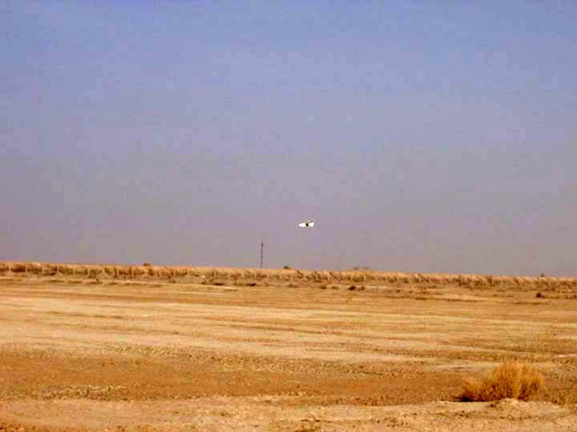 TALLIL AIR BASE, Iraq -- A Desert Hawk returns after patrolling the sky over here.  The Desert Hawk is a miniature unmanned aerial vehicle used by security forces to see beyond base perimeters providing a rapid assessment of threats.  (Courtesy photo)