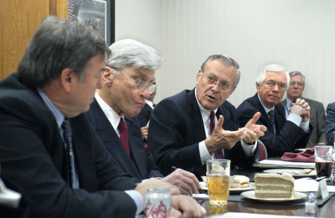 Secretary of Defense Donald H. Rumsfeld (center) responds to a question from Congressman Duncan Hunter of California during a luncheon briefing in the Pentagon to review the budget submission with congressional leaders on Feb. 7, 2005. Flanking Rumsfeld are Sen. John Warner (left) of Virginia and Sen. Thad Cochran (right) of Mississippi. 