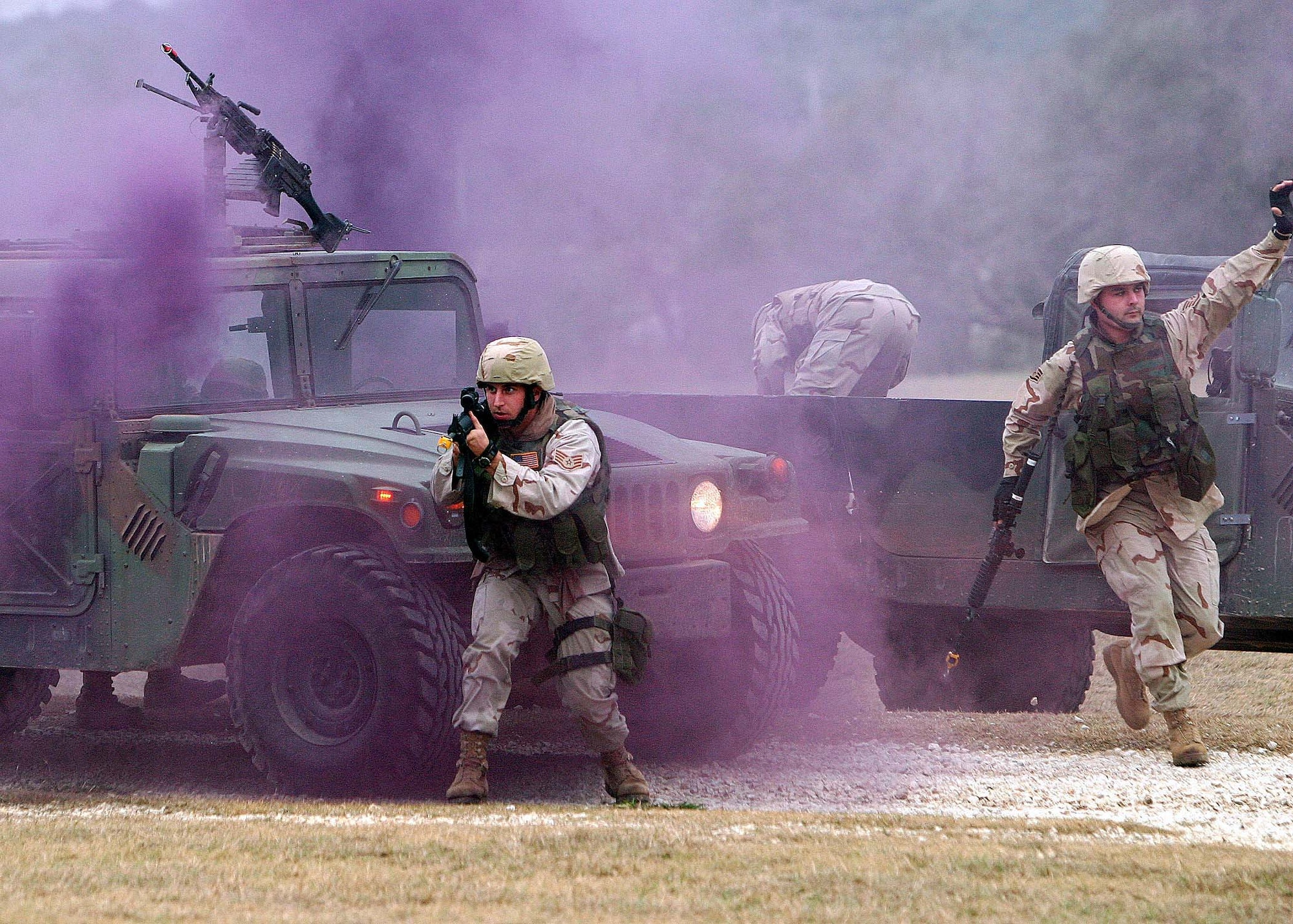 CAMP BULLIS, Texas -- Airmen participate in a Basic Combat Convoy Course here to train in the combat-type skills they will need during convoy operations in Iraq. In Iraq, Airmen help Soldiers and Marines run convoys throughout the country. More than 1,000 transportation, security forces, medical and personnel Airmen trained to help provide security. (U.S. Air Force photo by Robbin Cressell)