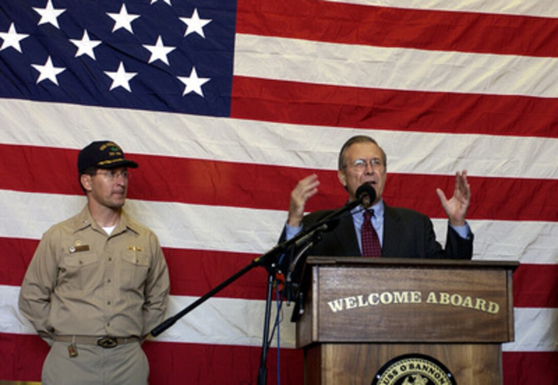 Secretary of Defense Donald H. Rumsfeld (right) speaks to the crew during an award ceremony with Cmdr. Troy A. Stoner, U.S. Navy, onboard the USS O'Bannon (DD 987) as the ship lies at anchor off the coast of Nice, France, on Feb. 9, 2005. Rumsfeld is aboard the Spruance class destroyer to speak to the crew and present various awards including Sailor and Shiphandler of the year. The Defense Secretary is in Nice to attend a conference with NATO Ministers of Defense. Stoner is the commanding officer of the Mayport, Fla., based destroyer. 