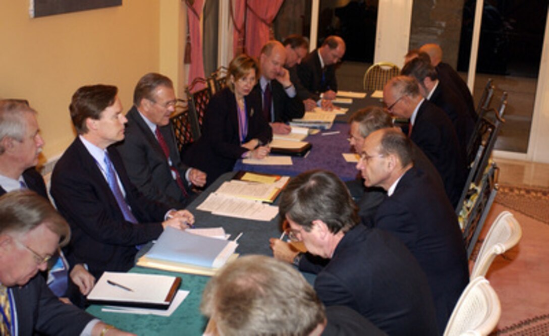 Secretary of Defense Donald H. Rumsfeld (fourth from left) and his senior advisors hold a bilateral meeting with NATO Secretary General Jaap de Hoop Scheffer and his staff in Nice, France, on Feb. 9, 2005. Rumsfeld is in Nice to attend a conference with NATO Ministers of Defense. The alliance defense ministers are meeting to take stock of NATO's transformation and review its operations. 