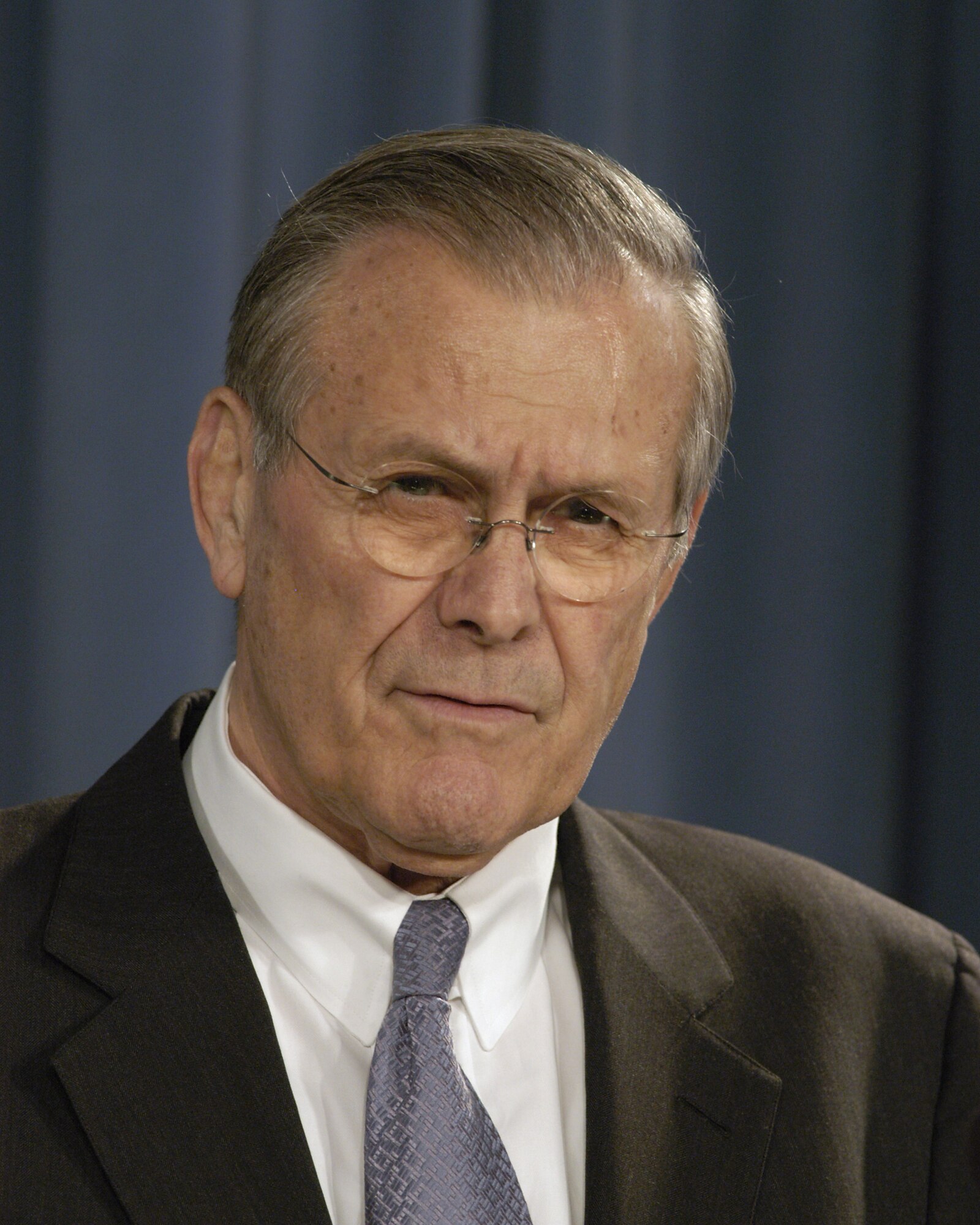 PENTAGON, Va. -- Secretary of Defense Donald H. Rumsfeld listens to a reporter's question during a Pentagon press briefing here Feb. 3.  (Department of Defense photo by Helene C. Stikkel)