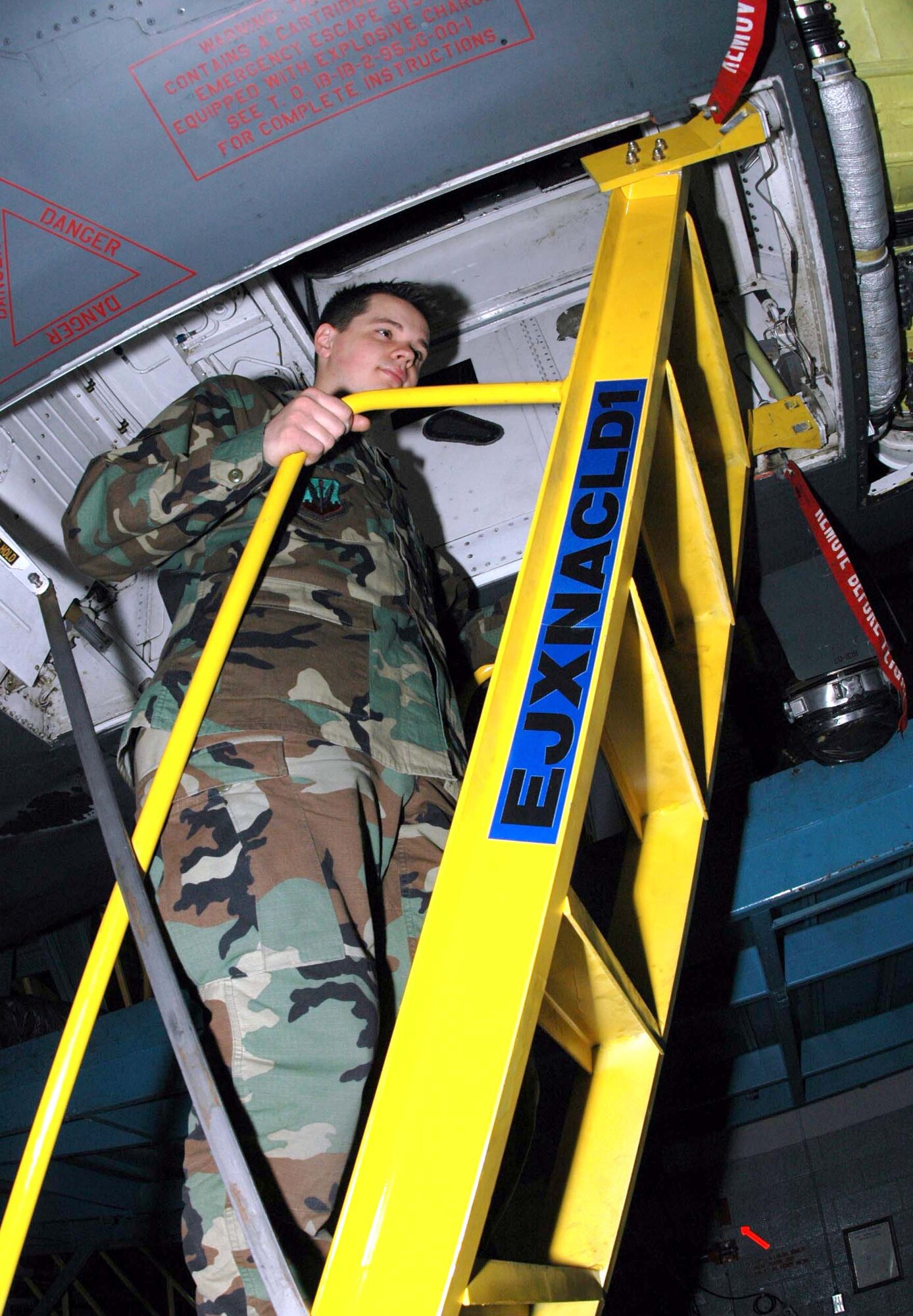 ELLSWORTH AIR FORCE BASE, S.D. -- Airman 1st Class David Browning climbs the temporary ladder used to inspect the cockpit of the B-1B Lancer.  The ladder was designed by Airmen here to make the aircraft more reliable.  Airman Browning is a 28th Maintenance Squadron B-1B phase inspector.  (U.S. Air Force photo by Senior Airman Raelynne J. Dennis)

