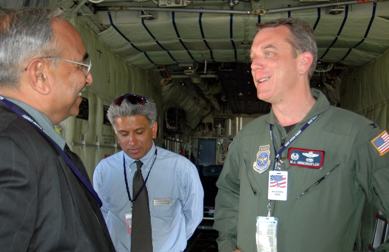 BANGALORE, India -- Col. Michael Underkofler (right) leads the tour of a C-130J Hercules during the Aero India International Air Show here Feb. 9.  The display included Navy P-3C Orions, KC-135 Stratotankers and F-15 Eagles.  Colonel Underkofler is the commander of the 403rd Operations Group.  (U.S. Air Force photo by Lt. Col. Mike Odom)