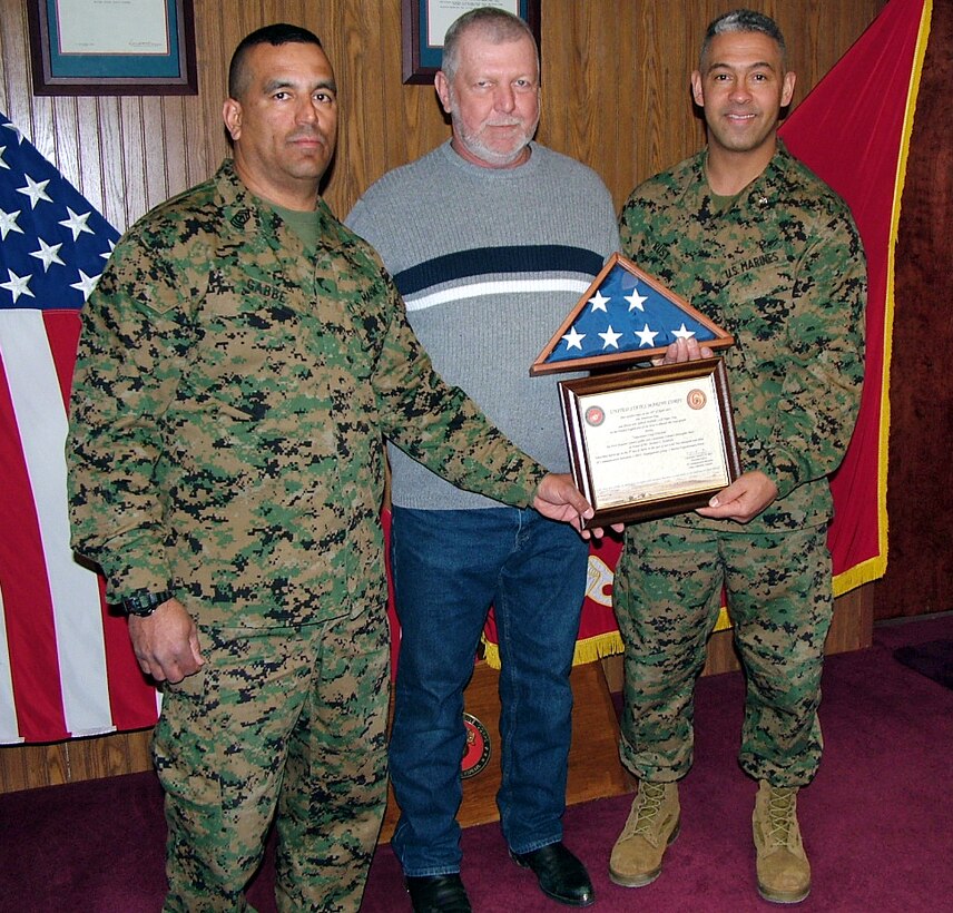 First Sergeant Genaro Gabbe, Headquarters Company First Sergeant (left), and Lt. Col. Christopher B. Rust, Administration Officer (far right), present Michael C. Kendrick, of KISKA Construction Company, with 6th Communication Battalion?s Employer Award during a ceremony in Brooklyn Feb. 12.  Gabbe worked for Kendrick before he was activated with 6th Comm.
