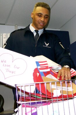 WASHINGTON -- Master Sgt. Robert Wilkins collects some of the more than 3,000 Valentine's Day cards the Air Force Pentagon Enlisted Council collected for wounded troops.  (U.S. Air Force photo by Staff Sgt. C. Todd Lopez)