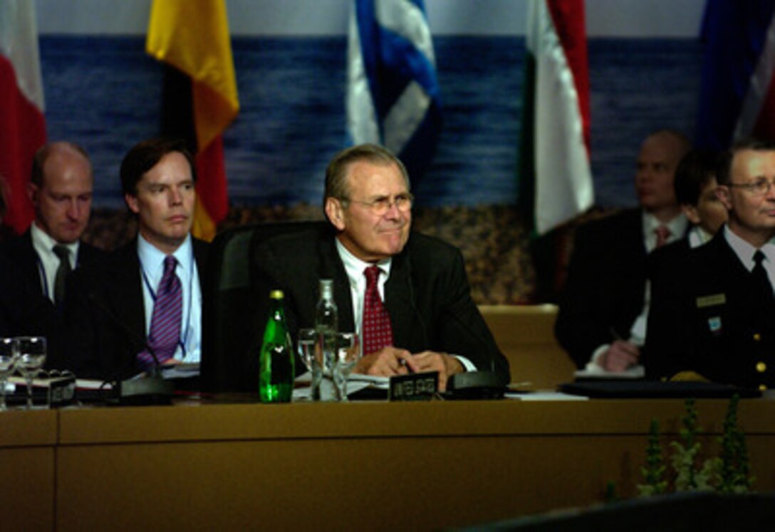 Secretary of Defense Donald H. Rumsfeld listens to a presentation at the NATO Defense Ministerial Conference in Nice, France, on Feb. 10, 2005. Rumsfeld is in Nice to attend a conference with his NATO counterparts. The alliance defense ministers are meeting to take stock of NATO's transformation and review its operations. 
