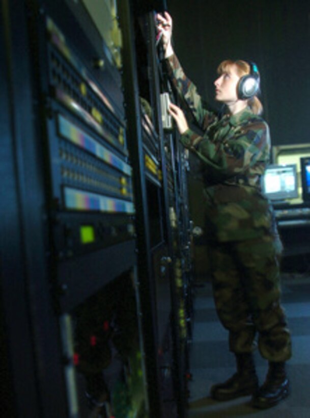 Staff Sgt. Michele Stumm checks the audio output levels of a Scoop Reporter II system during routine inspection on Feb. 11, 2005. Scoop Reporter II is back-up equipment for two-way signal transmission between a radio studio and transmitter. Stumm is an Air Force broadcast maintenance technician from American Forces Network on Yokota Air Base, Japan, who provides support for American Forces Network-Tokyo and all other Air Force broadcast detachments in the Pacific theater. 