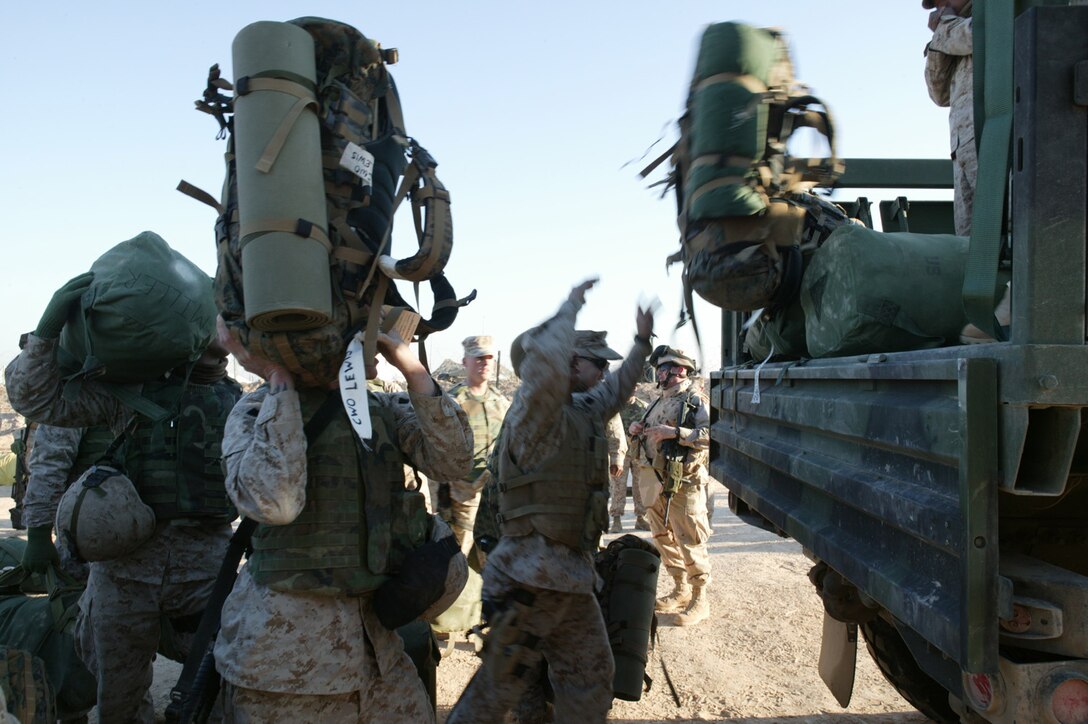 Marines with 2nd Battalion, 10th Marine Regiment stow their luggage for transportation to an air terminal on Feb. 15, 2005 as they prepare to depart Camp Taqaddum, Iraq after completing a seven-month deployment. The Lejeune-based battalion's departure is part of a mass turnover of Marine forces in Iraq's Al Anbar Province. In coming weeks, more than 20,000 Marines from the II Marine Expeditionary Force will be replacing the I Marine Expeditionary Force. Already, Marines from 2nd FSSG, which falls under the Camp Lejeune-based II MEF, are beginning to replace Marine units of 1st FSSG, which has served as the central logistical hub for the 31,000 Marines, sailors, and soldiers of I MEF.