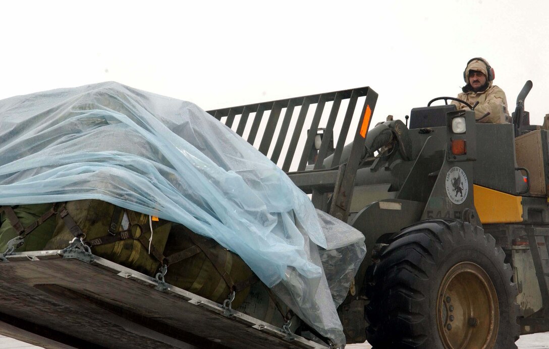 BAGRAM AIR BASE, Afghanistan -- Staff Sgt. Robert Willis uses a forklift to move cargo onto a C-17 Globemaster III.  Sergeant Hutchinson is an air transportation specialist with the 455th Expeditionary Logistics Readiness Squadron here, deployed from Dobbins Air Reserve Base, Ga.  (U.S. Air Force photo by Capt. Catie Hague)
