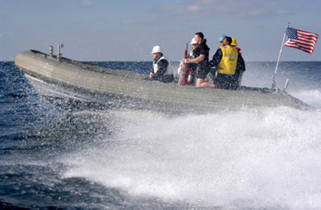 U.S. Navy sailors from the USS Harry S. Truman (CVN 75) conduct small boat drills in a Rigid-Hull Inflatable Boat, or RHIB, in the Persian Gulf on Feb. 8, 2005. The Truman and its embarked Carrier Air Wing 3 are providing close air support and conducting intelligence, surveillance and reconnaissance missions over Iraq. 