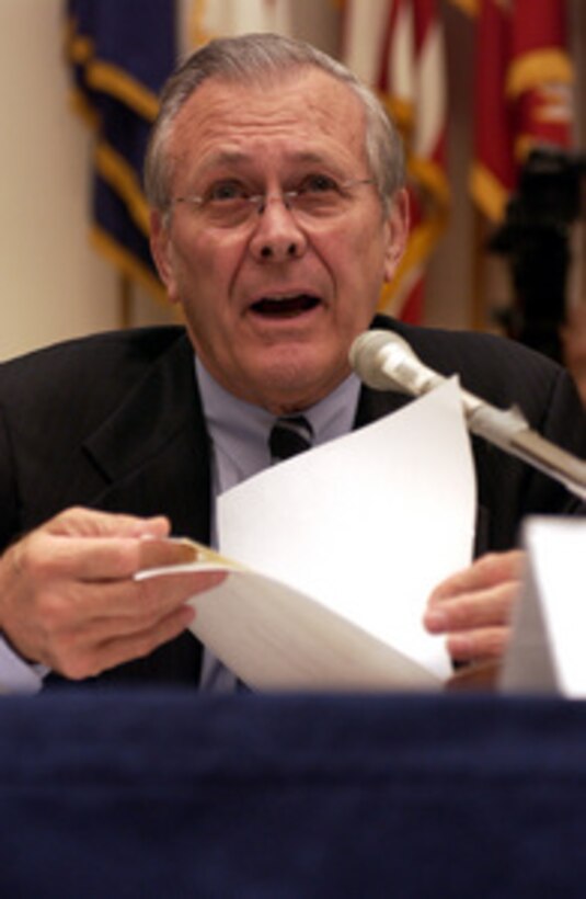 Secretary of Defense Donald H. Rumsfeld refers to his notes as he answers a representative's question during a House Armed Services Committee hearing in the Rayburn House Office Building in Washington, D.C., on Feb. 16, 2005. Chairman of the Joint Chiefs of Staff Gen. Richard B. Myers, U.S. Air Force, and Under Secretary of Defense Comptroller Tina Jonas joined Rumsfeld in testifying before the committee. 