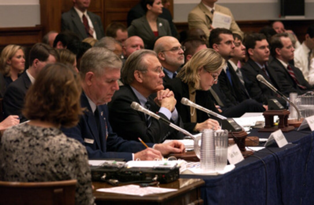 Secretary of Defense Donald H. Rumsfeld (2nd from left) listens intently to a representative's question during a House Armed Services Committee hearing in the Rayburn House Office Building in Washington, D.C., on Feb. 16, 2005. Chairman of the Joint Chiefs of Staff Gen. Richard B. Myers (left), U.S. Air Force, and Under Secretary of Defense Comptroller Tina Jonas (3rd from left) joined Rumsfeld in testifying before the committee. 