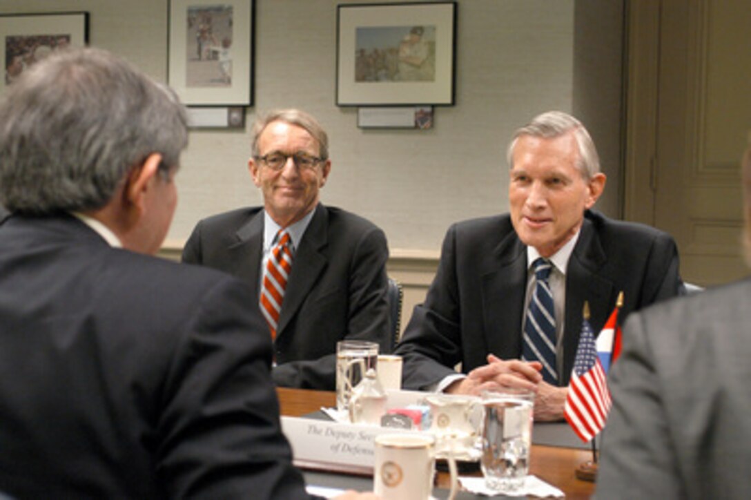 Minister of Foreign Affairs Bernard Bot (right), of the Netherlands, meets with Deputy Secretary of Defense Paul Wolfowitz (foreground) in the Pentagon on Feb. 17, 2005. Netherlands' Ambassador to the United States Boudewijn van Eenennaam (center) joined Bot and Wolfowitz to discuss a range of bilateral security issues. 