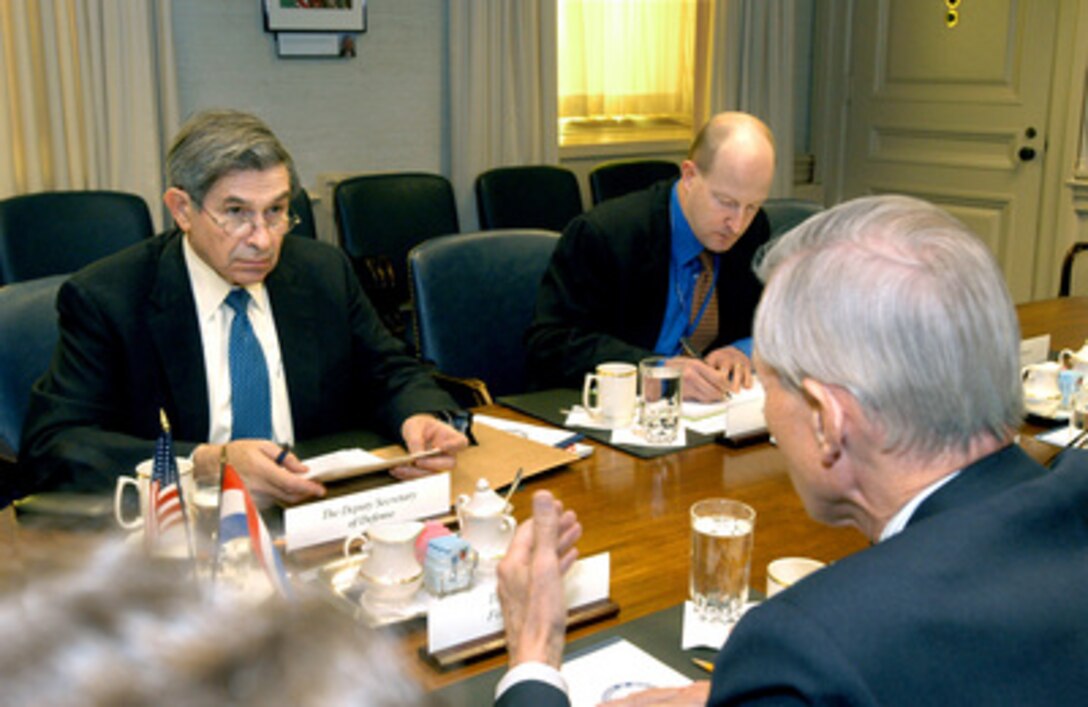 Deputy Secretary of Defense Paul Wolfowitz (left) hosts a Pentagon meeting with Minister of Foreign Affairs Bernard Bot (foreground), of the Netherlands, on Feb. 17, 2005. Deputy Assistant Secretary of Defense for European and NATO Affairs Ian Brzezinski (center) joined Wolfowitz and Bot to discuss a range of bilateral security issues. 