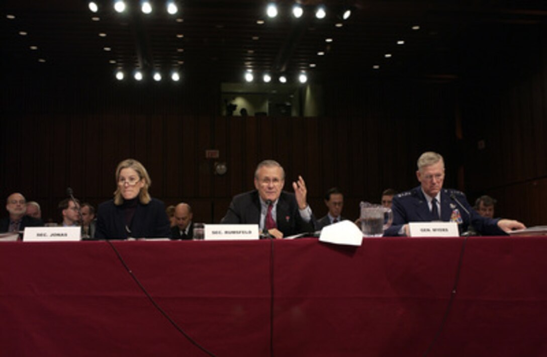 Secretary of Defense Donald H. Rumsfeld (center) gestures to make a point as he answers a senator's question during a Senate Armed Services Committee hearing in the Hart Senate Office Building in Washington, D.C., on Feb. 17, 2005. Chairman of the Joint Chiefs of Staff Gen. Richard B. Myers (right), U.S. Air Force, and Under Secretary of Defense Comptroller Tina Jonas (left) joined Rumsfeld in testifying before the committee. 
