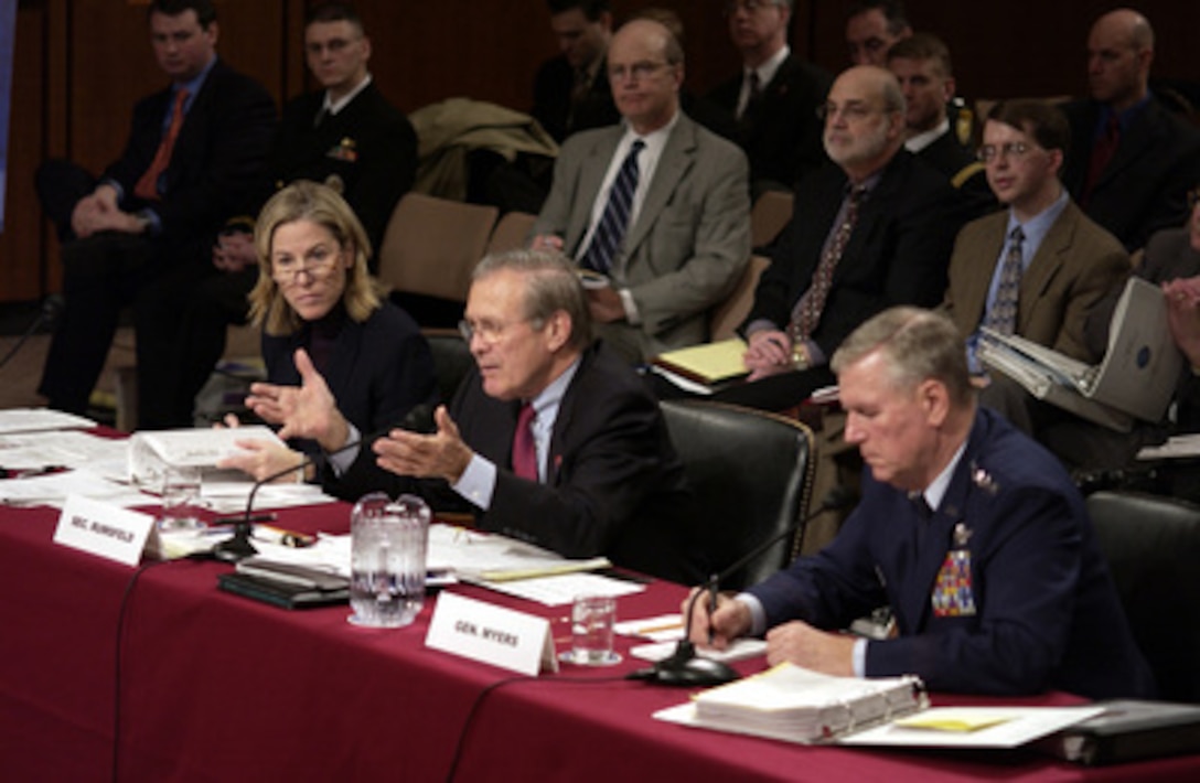 Secretary of Defense Donald H. Rumsfeld (center) gestures to make a point as he answers a senator's question during a Senate Armed Services Committee hearing in the Hart Senate Office Building in Washington, D.C., on Feb. 17, 2005. Chairman of the Joint Chiefs of Staff Gen. Richard B. Myers (right), U.S. Air Force, and Under Secretary of Defense Comptroller Tina Jonas (left) joined Rumsfeld in testifying before the committee. 