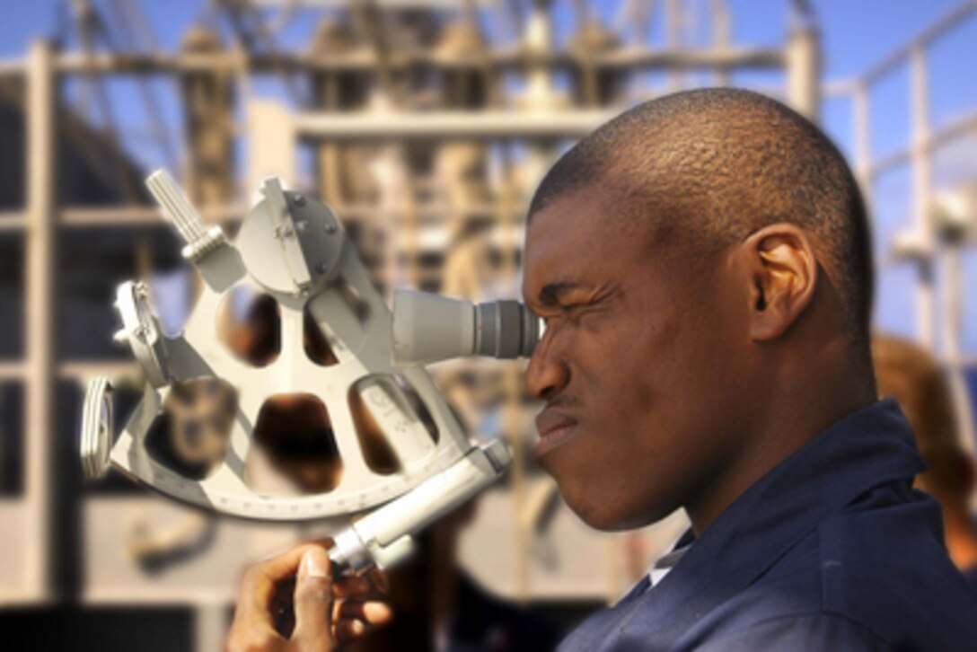 U.S. Navy Seaman Robert Hill takes celestial readings using a sextant on the signal bridge of the aircraft carrier USS Abraham Lincoln (CVN 72) on Feb. 17, 2005. The Lincoln and its embarked Carrier Air Wing 2 are currently deployed to the western Pacific Ocean. 