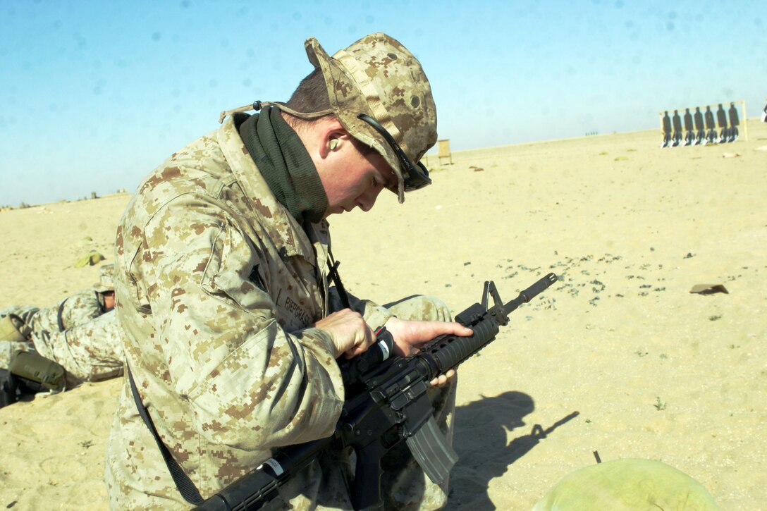 UDAIRI RANGE, Kuwait (Feb. 18, 2005) -- Cpl. James P. Piepgrass, 24, a reconnaissance Marine with Battalion Landing Team 1/1's Recon Platoon, and a native of Cape Cod, Mass., adjusts the windage on an Advanced Combat Optical Gunsight to get his battle sight zero. Battle sight zeros are the sight settings they use to fire accurately in combat. Marines attached to the 15th Marine Expeditionary Unit (Special Operations Capable) are training in Kuwait to maintain their combat readiness.