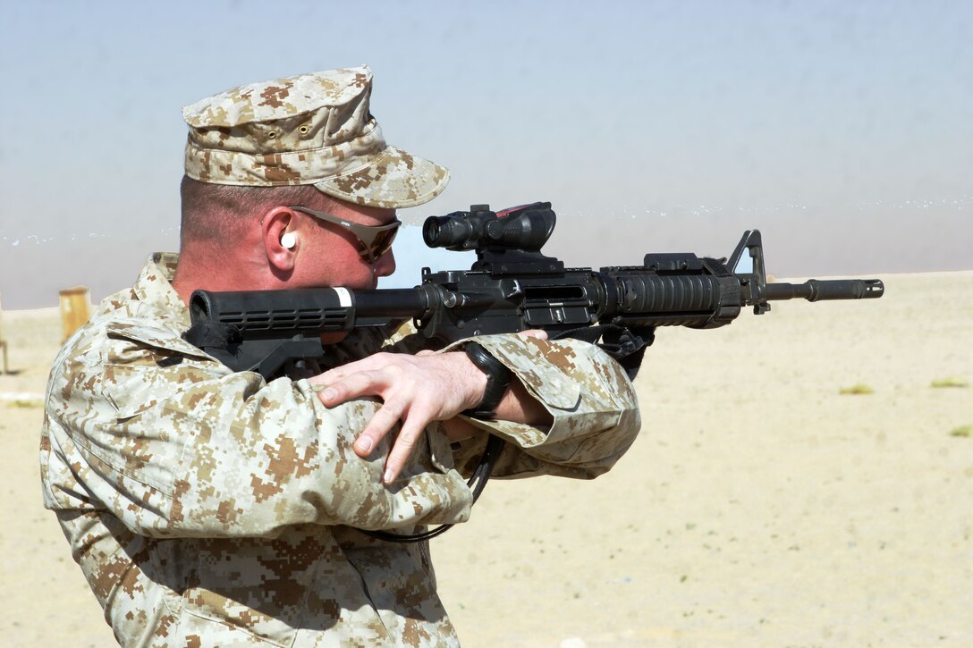 UDAIRI RANGE, Kuwait (Feb. 18, 2005) -- Sgt. Kelly L. Cullins, 30, a reconnaissance Marine with Battalion Landing Team 1/1's Recon Platoon, and a native of Portland, Ore., spots the target after getting his battle sight zero. Battle sight zeros are the sight settings they use to fire accurately in combat. Marines attached to the 15th Marine Expeditionary Unit (Special Operations Capable) are training in Kuwait to maintain their combat readiness.