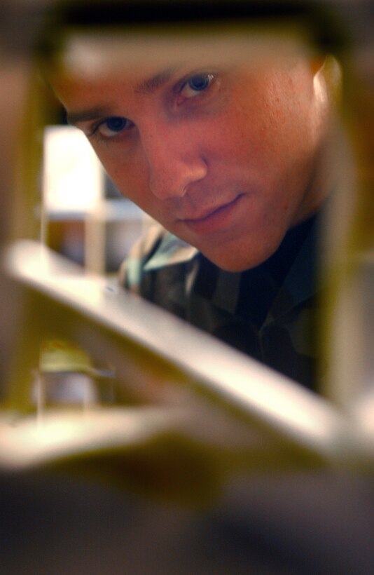 AVIANO AIR BASE, Italy -- Airman 1st Class Chris Rowlen pitches mail delivered to the post office here Feb. 15. Airmen Rowlen is assigned to the 31st Communication Squadron. (U.S. Air Force photo by Airman 1st Class Desiree Hayden)    