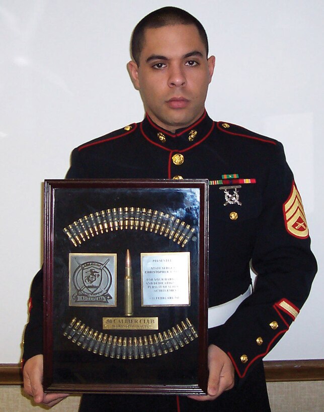 SSgt. Christopher Perdue holds his recently acquired .50 cal club award proudly.